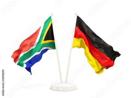Two waving flags of South Africa and germany isolated on white