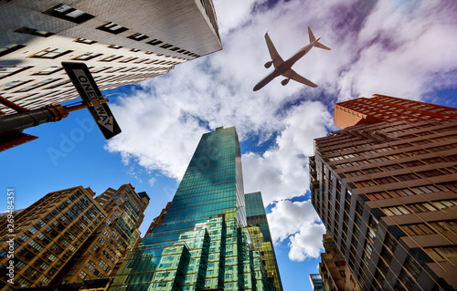 Photography Plane flies low over the New York City Manhattan Skyline USA