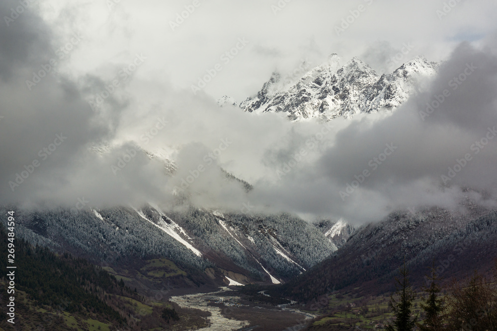 clouds in front of mountain in caucasus clouds in front of mountain in caucasus