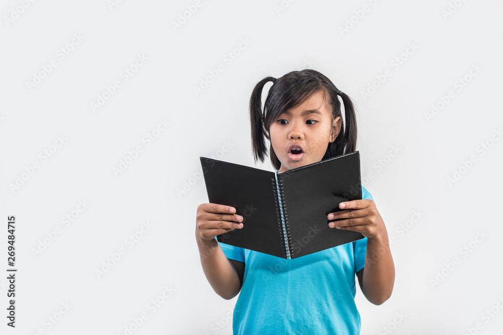 little girl reading book in studio shot little girl reading book in studio shot