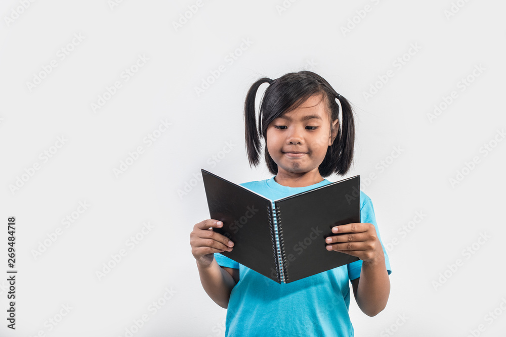 little girl reading book in studio shot little girl reading book in studio shot