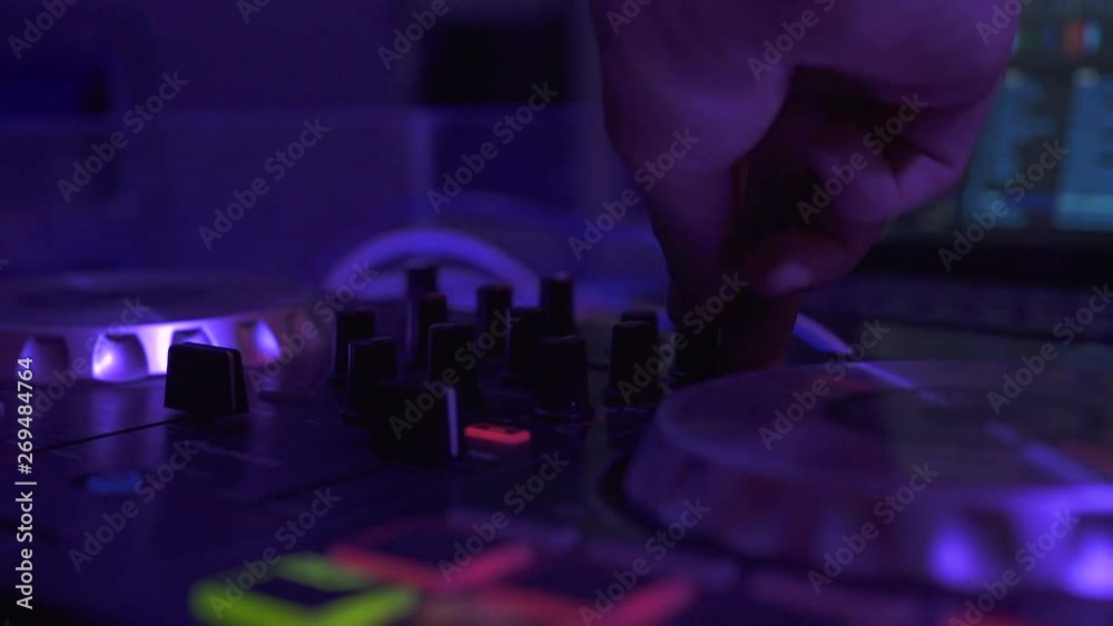 DJ control sound console ant laptop for mixing music in night club party. DJ mixer player and