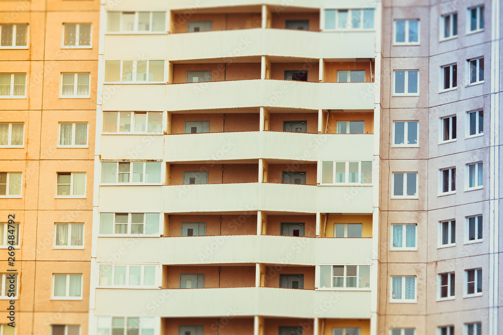 window background of a high multi-storey residential building. Many windows.