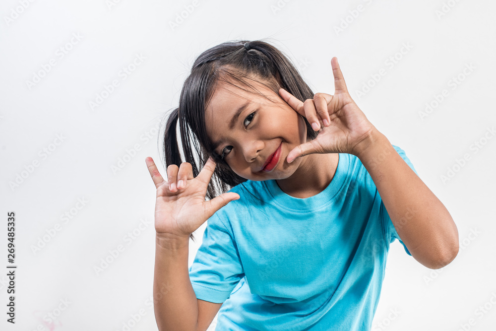 Portrait of Funny little girl acting in studio shot Portrait of Funny little girl acting in studio shot