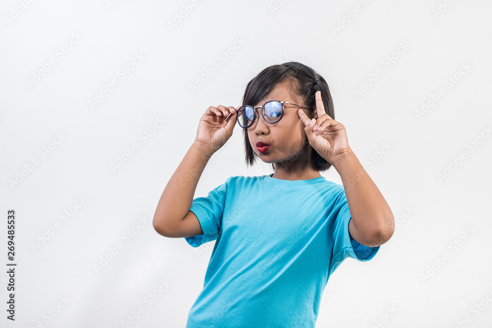 Portrait of Funny little girl acting in studio shot Portrait of Funny little girl acting in studio shot