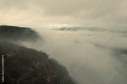 Low cloud in a valley in the mountains.