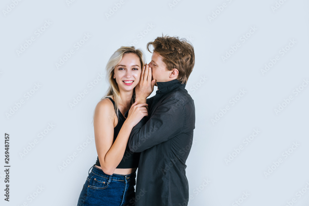 Happy couple whispering something Happy couple whispering something
