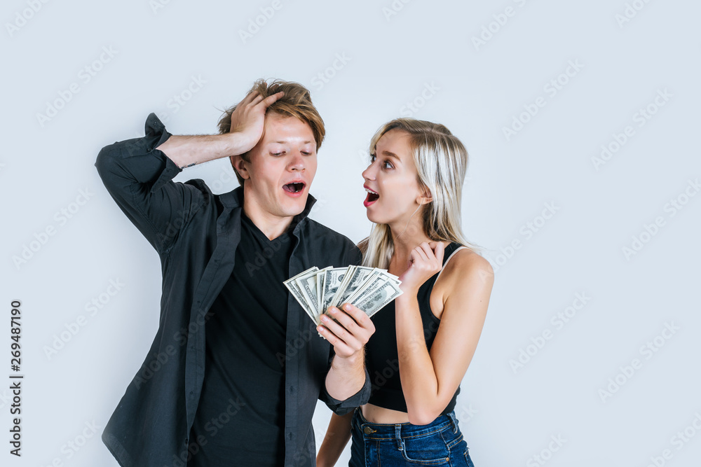 Happy couple show dollar banknote make some business Happy couple show dollar banknote make some business