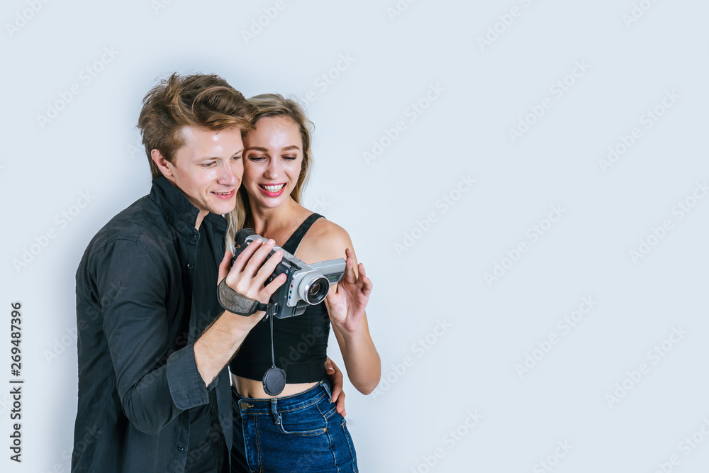 Happy portrait of Couple holding Video camera and Record clip video Happy portrait of Couple holding Video camera and Record clip video