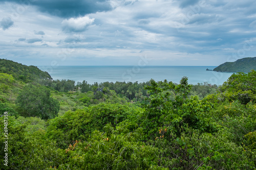 On the green mountain by the beach Overlooking the sea and sky