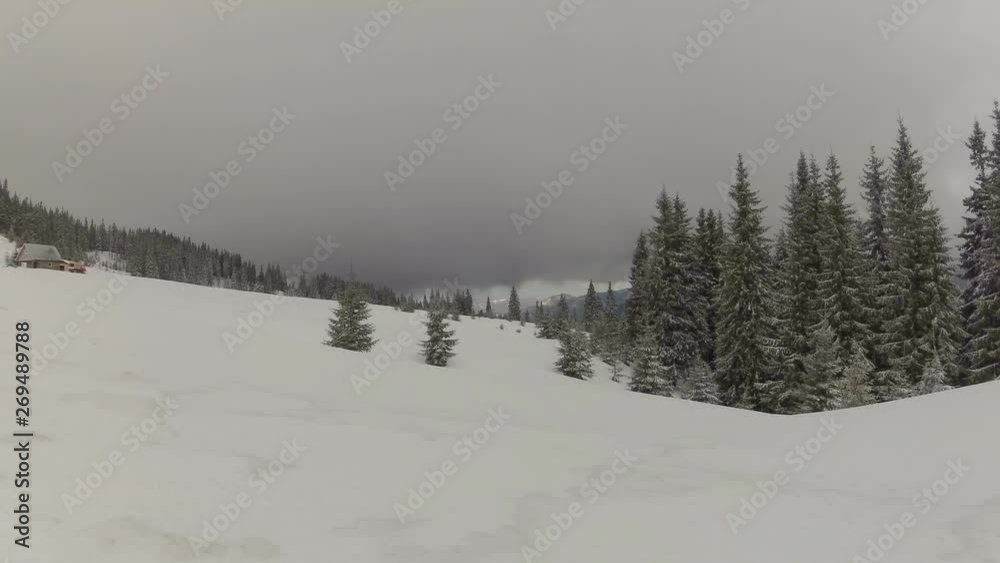 Timelapse with low clouds running above Carpathian mountains in winter Timelapse with low clouds running above Carpathian mountains in winter