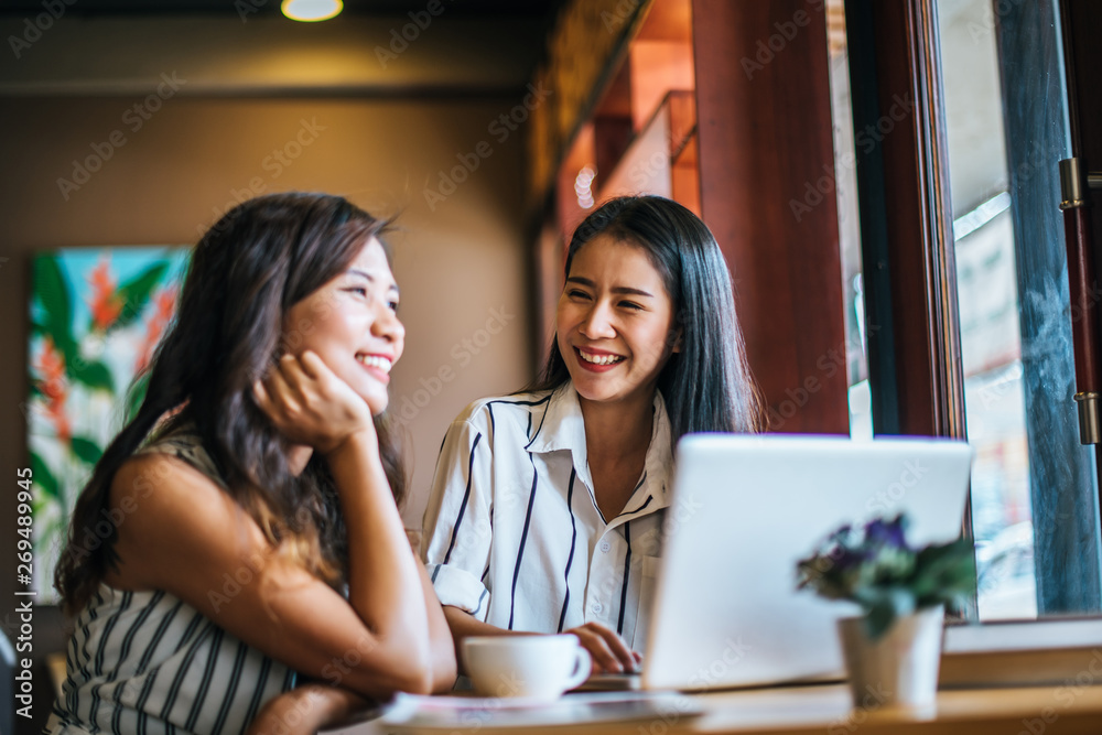 Two beautiful women talking everything together at coffee shop cafe Two beautiful women talking everything together at coffee shop cafe