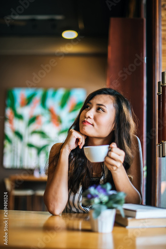 Portrait asian woman smiling relax in coffee shop cafe