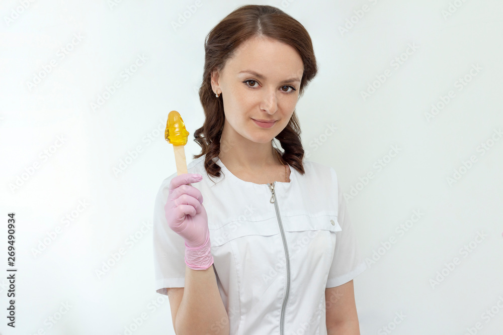 sugar depilation cosmetic procedure shugaring beautiful girl master holds sugar paste in his hands concept sugar depilation cosmetic procedure shugaring beautiful girl master holds sugar paste in his hands concept