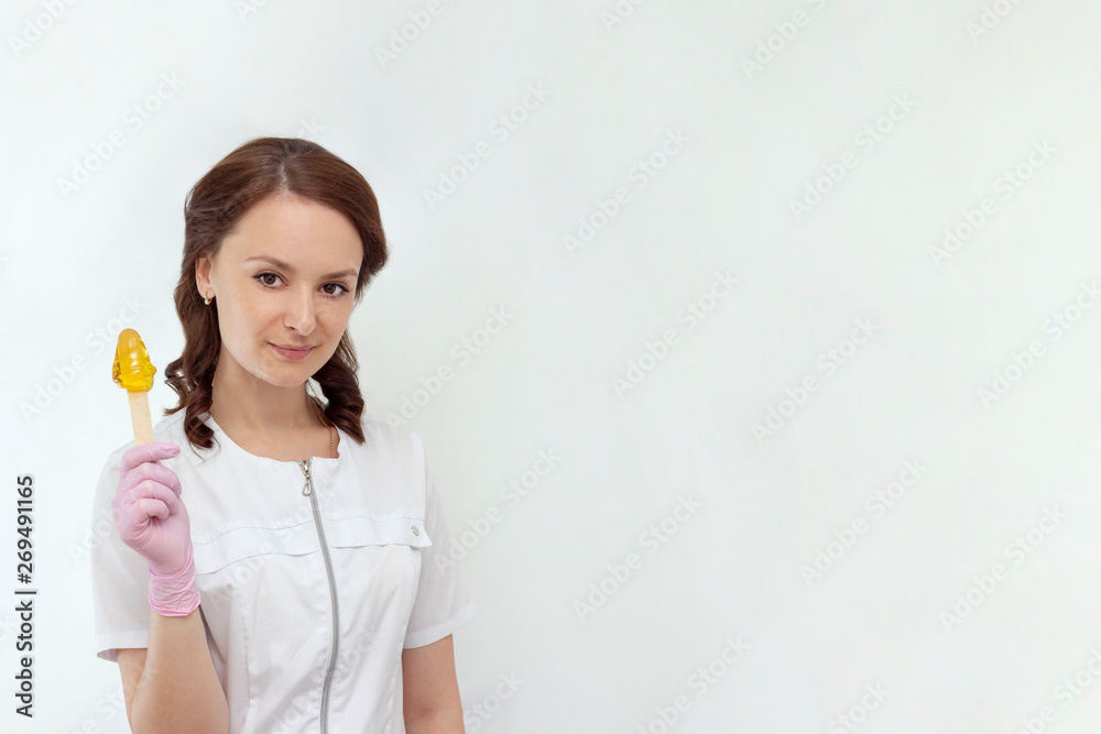 sugar depilation cosmetic procedure shugaring beautiful girl master holds sugar paste in his hands concept copy space sugar depilation cosmetic procedure shugaring beautiful girl master holds sugar paste in his hands concept copy space