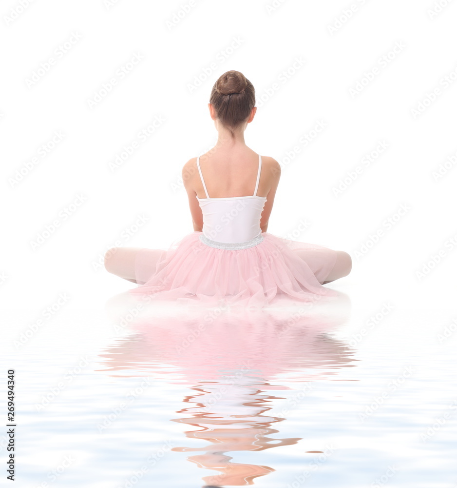 Fototapeta premium young girl ballerina posing on white background