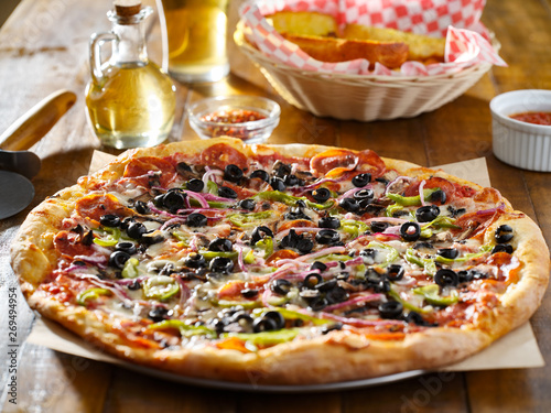 tasty supreme pizza with olives peppers onions and sausage