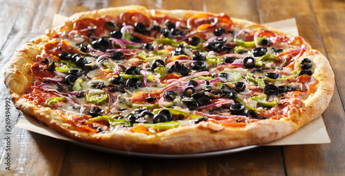 Tablou pe pânză tasty supreme pizza with olives peppers onions and sausage