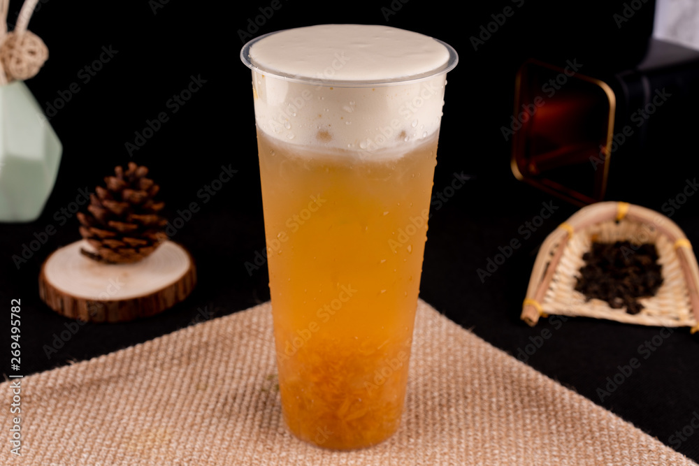 Fresh pressed frozen tea beverage in black background Fresh pressed frozen tea beverage in black background