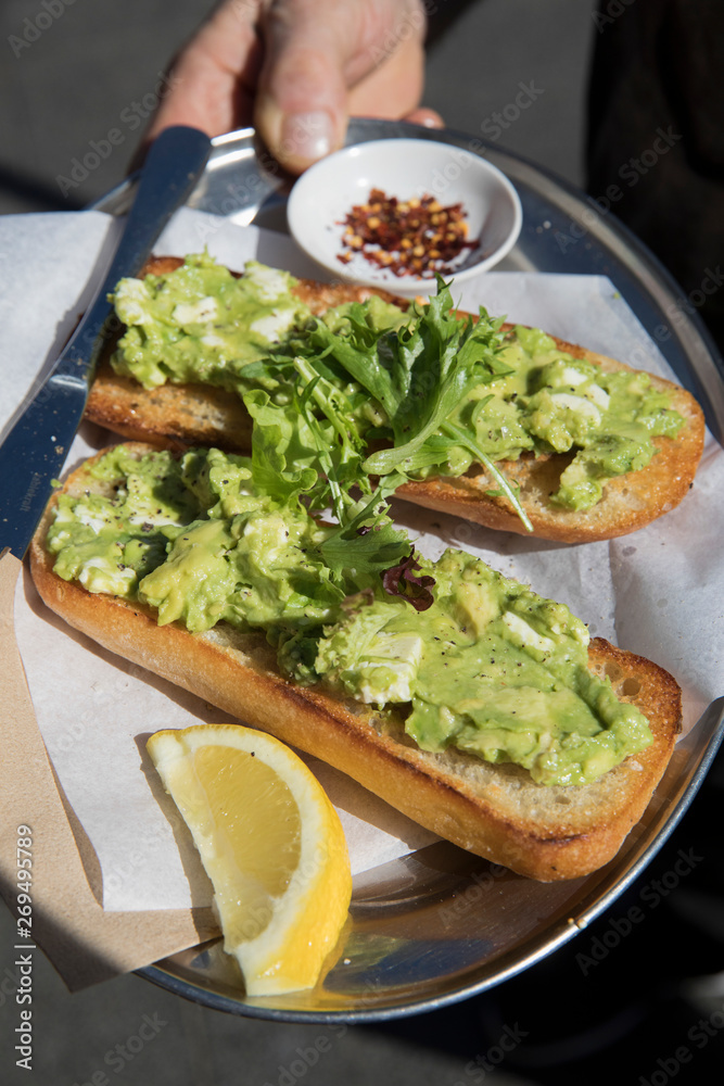 Avocado and Salad on Baguette with Lemon and Chilli Pepper