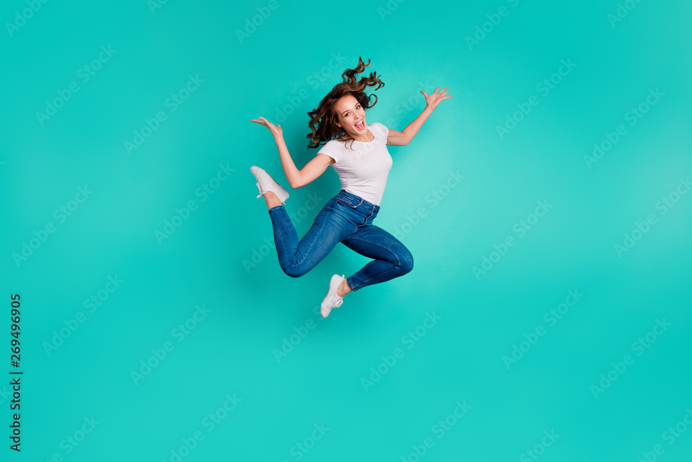 Full length body size view of nice attractive lovely carefree sportive slim fit thin crazy cheerful cheery overjoyed wavy-haired lady having fun isolated on bright vivid shine blue background