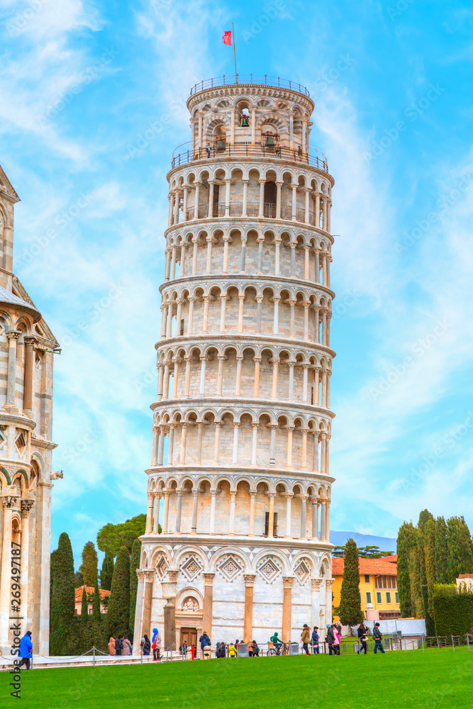 The Leaning Tower and Pisa Cathedral at bright blue sky - Pisa, Italy
