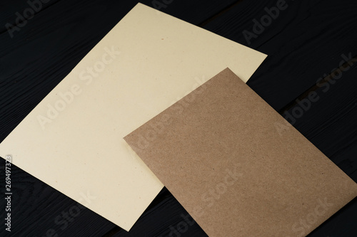 empty letter with envelope on black wood