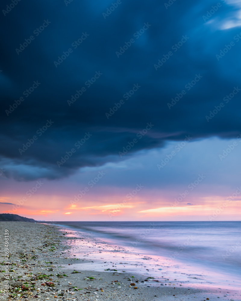 Stormy sunset on beach