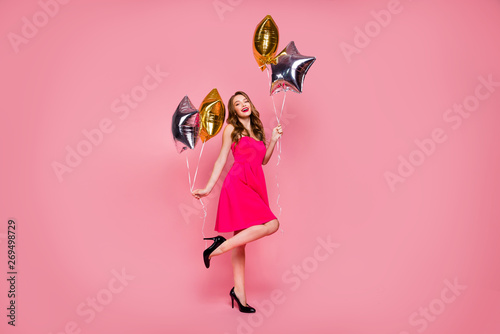 Full length side profile body size photo beautiful she her lady graduation day weekend hand arm star shape golden balloons gift present wear colorful formal-wear dress isolated pink bright background