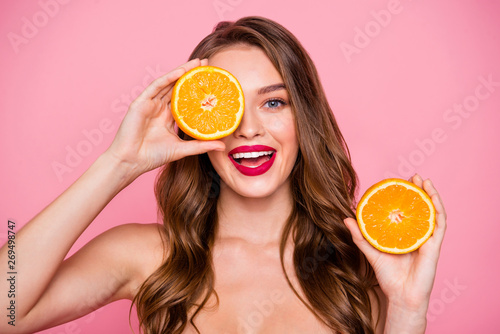 Close up photo beautiful amazing she her lady arms two orange slices hide one eye perfect allure lips natural body care useful influence wear no clothes naked nude isolated pink bright background photo