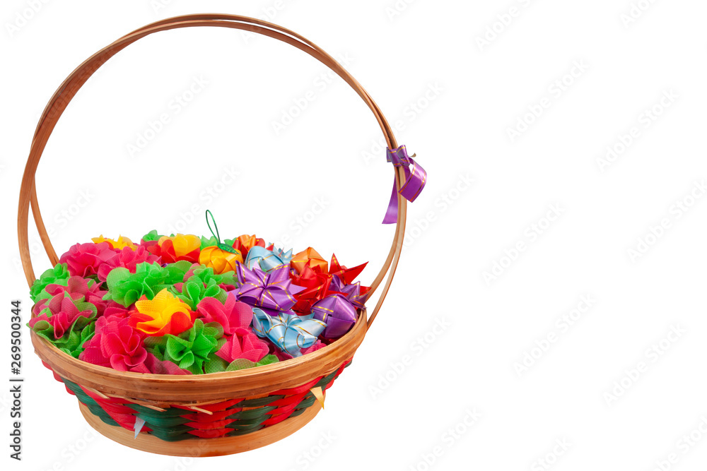 Fold the colorful mulberry paper or ribbon and put the coin inside in basket for donate in buddhism of Thailand isolated on white background.