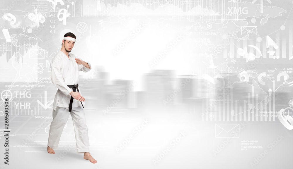 Young karate trainer doing karate tricks on the top of a metropolitan city
Young karate trainer doing karate tricks on the top of a metropolitan city
