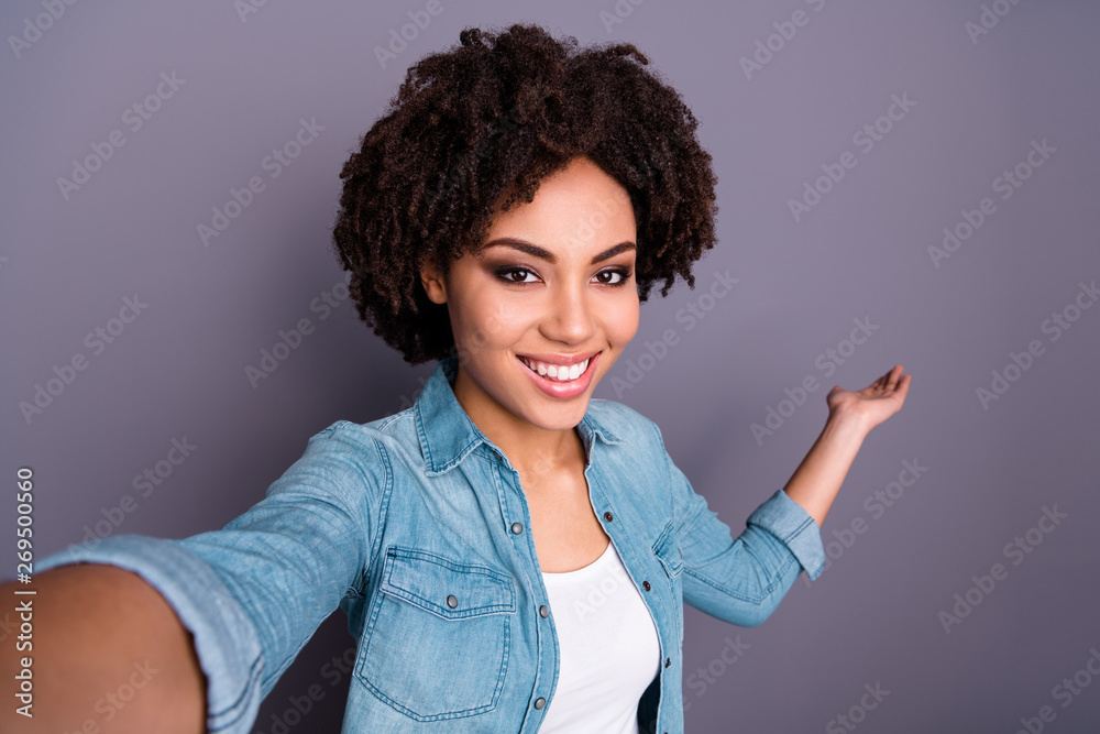 Close up photo of candid cheerful attractive lady make photos advertise choose option decide select suggest recommend adverts advice dressed denim clothes outfit isolated grey background Close up photo of candid cheerful attractive lady make photos advertise choose option decide select suggest recommend adverts advice dressed denim clothes outfit isolated grey background