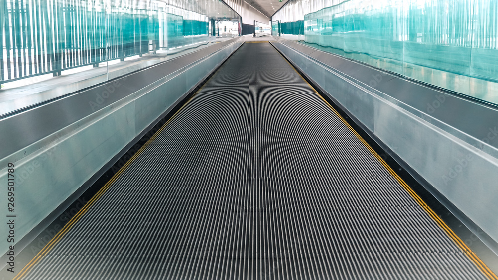 Modern walkway of escalator move forward and escalator move backward in international airport. Escalator is facility for support transportation