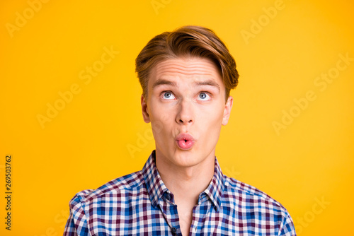 Close up photo amazing youngster he him his man excited look up empty space lips mouth perfect ideal o shape figure form wear casual plaid checkered shirt outfit isolated yellow bright background
