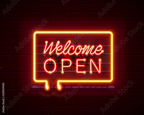 Neon welcome open signboard on the brick wall background. 