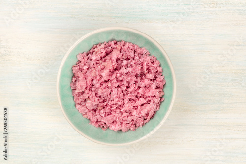 A bowl of pink Himalayan sea salt, shot from the top