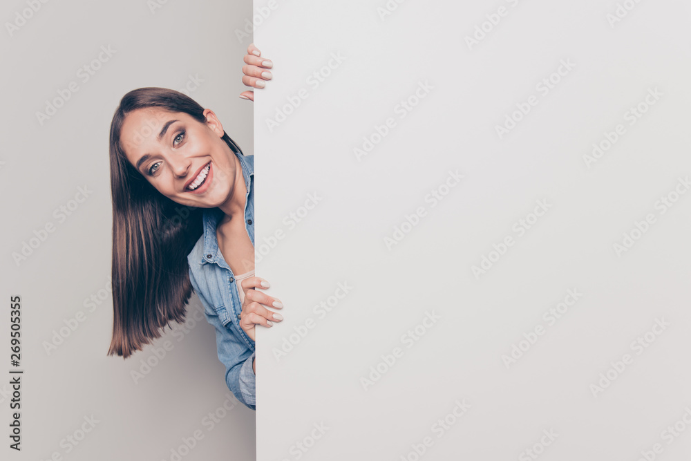 Portrait of her she nice-looking attractive lovely sine cheerful cheery straight-haired lady holding hands behind big large promotion ad advert isolated over light white gray background Portrait of her she nice-looking attractive lovely sine cheerful cheery straight-haired lady holding hands behind big large promotion ad advert isolated over light white gray background