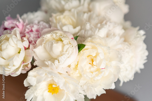 White peonies in a metal vase. Beautiful peony flower for catalog or online store. Floral shop concept . Beautiful fresh cut bouquet. Flowers delivery
