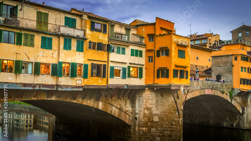 Ponte Vecchio bridge spans the Arno River in Florence, Italy © CrackerClips