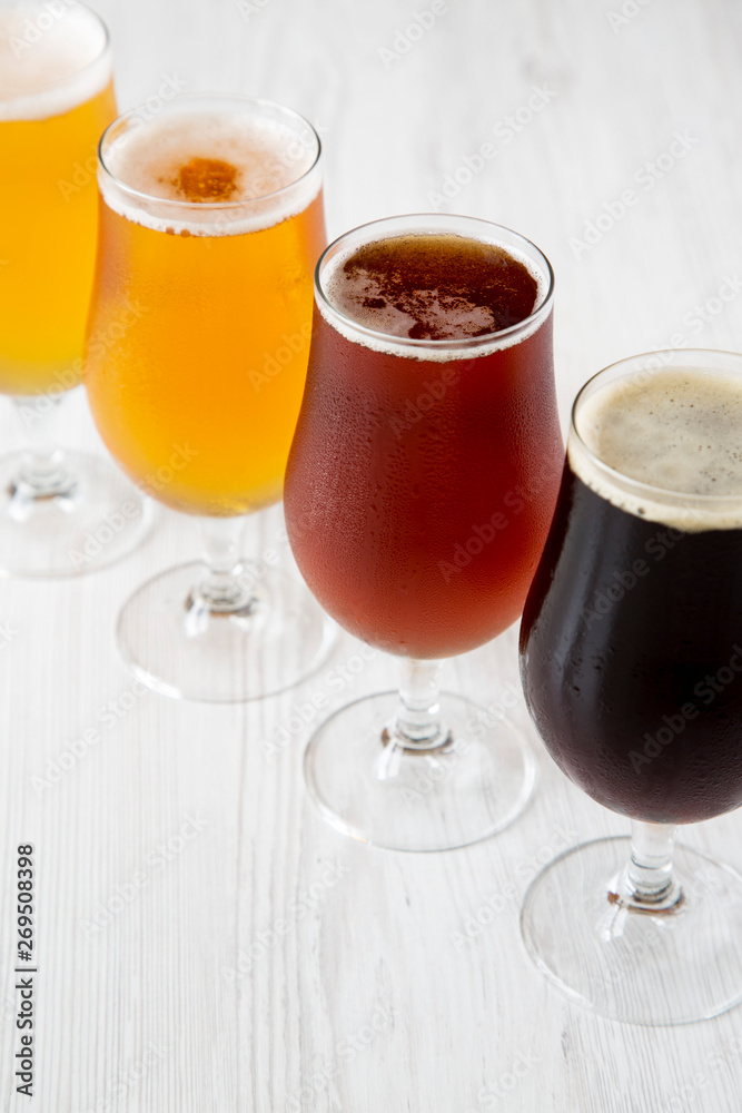 Cold craft beer assortment, side view. Close-up. Cold craft beer assortment, side view. Close-up.