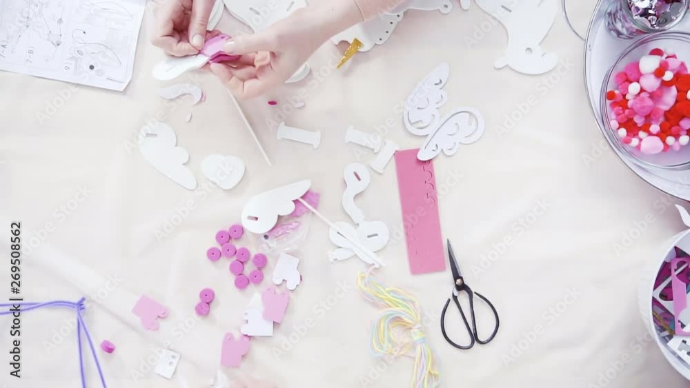 Flat lay. Step by step. Mother and daughter making unicorn craft from paper foam. Flat lay. Step by step. Mother and daughter making unicorn craft from paper foam.
