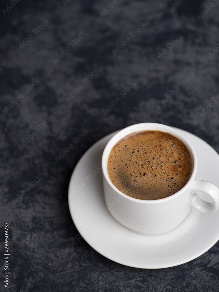 White espresso Cup on dark background with copyspace White espresso Cup on dark background with copyspace