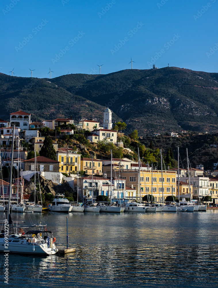 View to the marina of Poros town with yachts and clock tower, Poros island, Saronic islands, Greece 