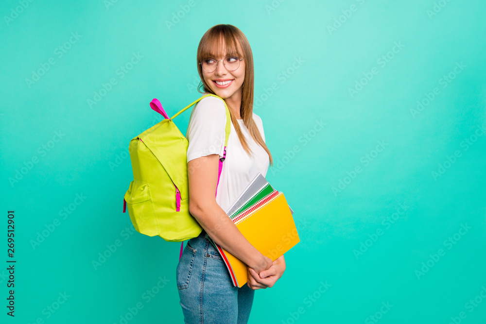 Close up side profile photo beautiful she her lady look empty space arms hands school colored notebooks modern backpack listen groupmates wear specs casual white t-shirt isolated teal green background - obrazy, fototapety, plakaty 