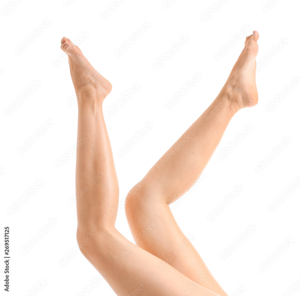 Legs of beautiful young woman after depilation on white background Legs of beautiful young woman after depilation on white background