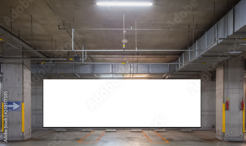Empty Indoor car park with blank billboard