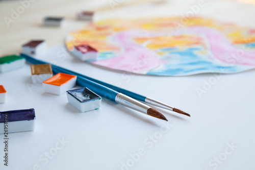 Watercolor paints and drawing supplies © Anna
