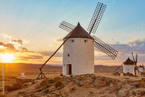 Traditional antique windmills at sunset in Spain. Consuegra, Toledo photo