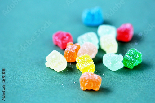 cbd gummy bears vitamin on green background